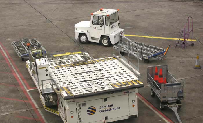 A greyish image of airport vehicles | All rights reserved by the image creator: Maarten Idema. Copyright 2006.